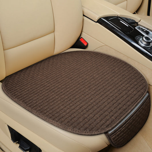 Brown car seat cushion on a beige car seat