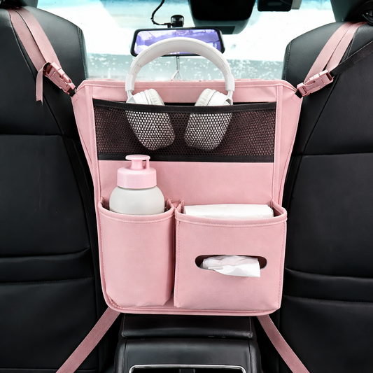 Pink car organizer hanging on a car seat with various items inside.