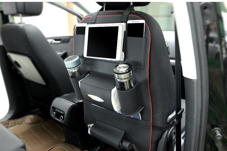 Car seat organizer with tablet holder and cup holders in a vehicle.